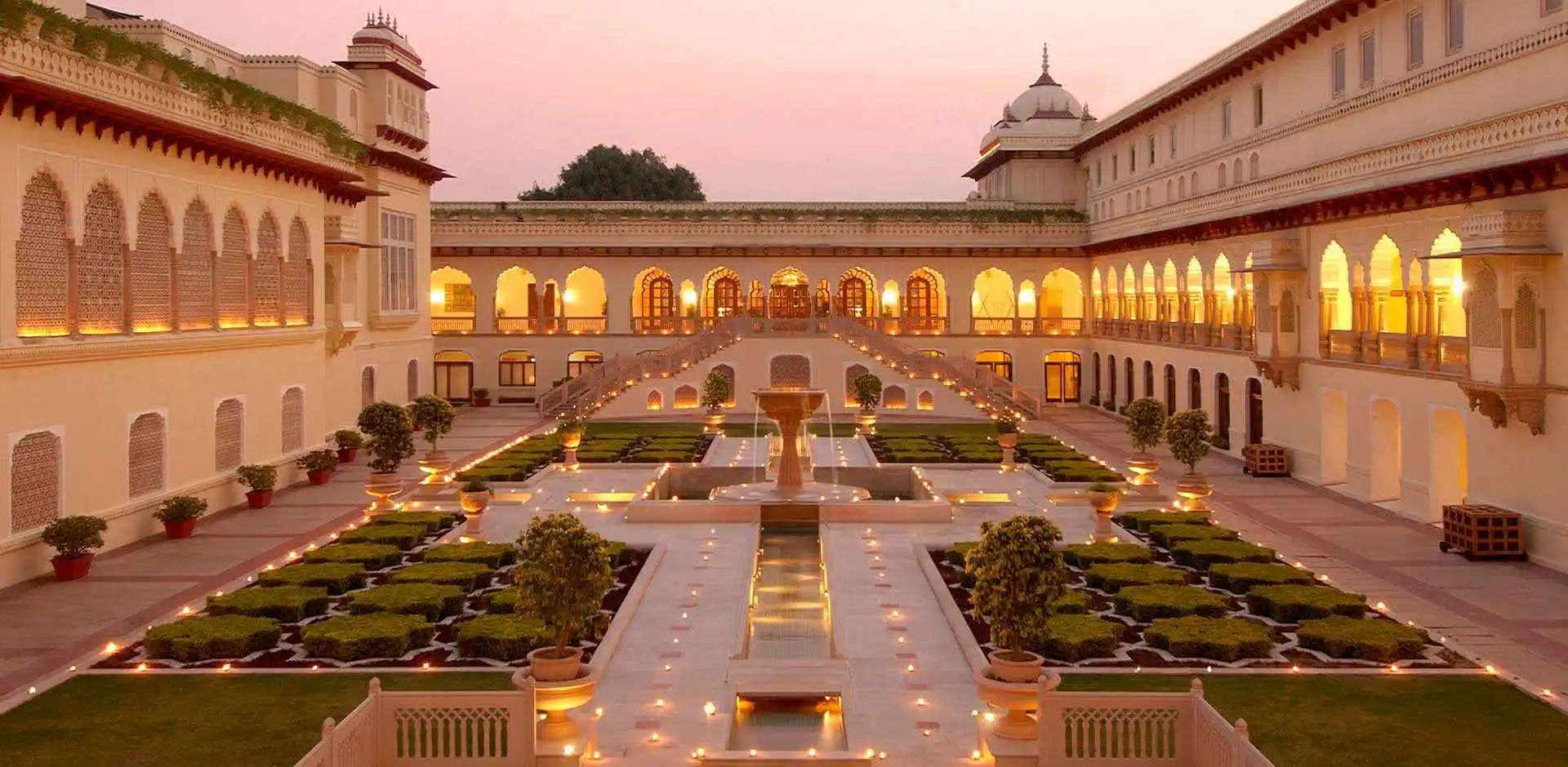 Rambagh Palace Jaipur exterior with domes, arches and Mughal gardens