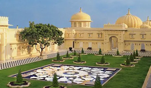 The Oberoi Udaivilas domes and courtyards overlooking Lake Pichola at sunset