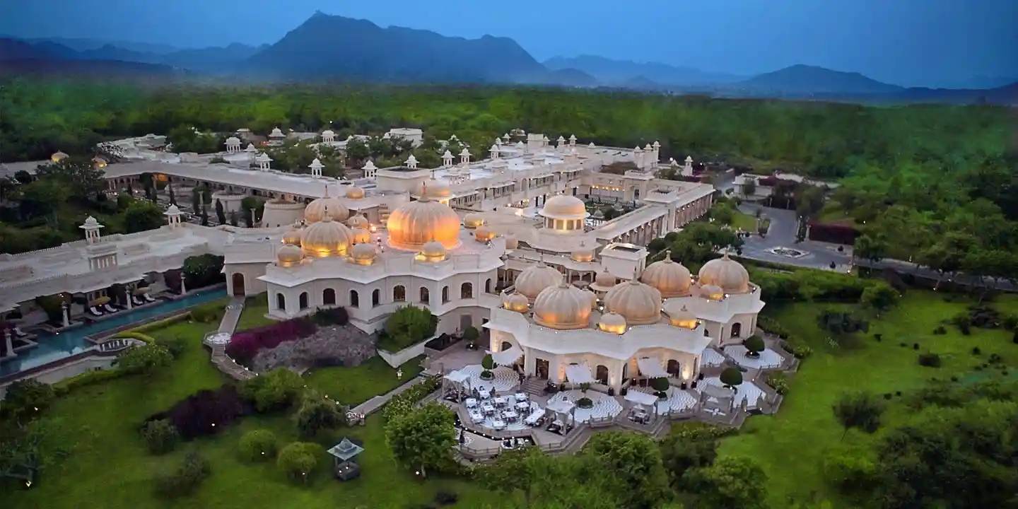 Main pool at The Oberoi Udaivilas with palace architecture and lake views